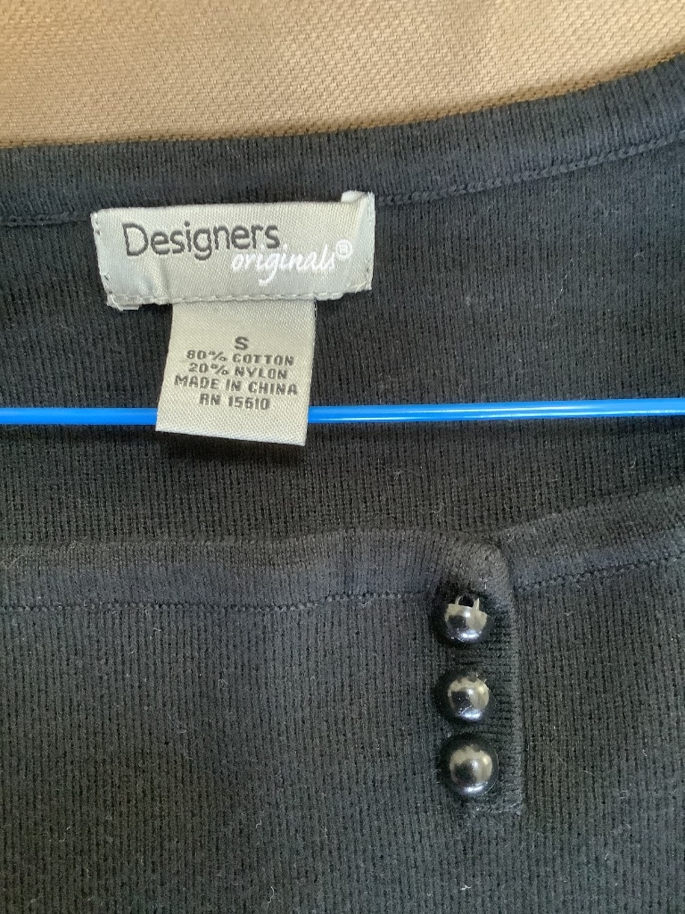 Designers sleeveless black knit top. Size small